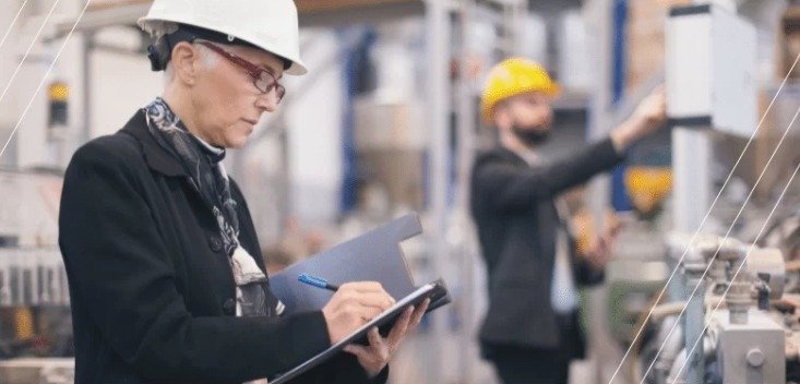 A person taking notes in a notebook.