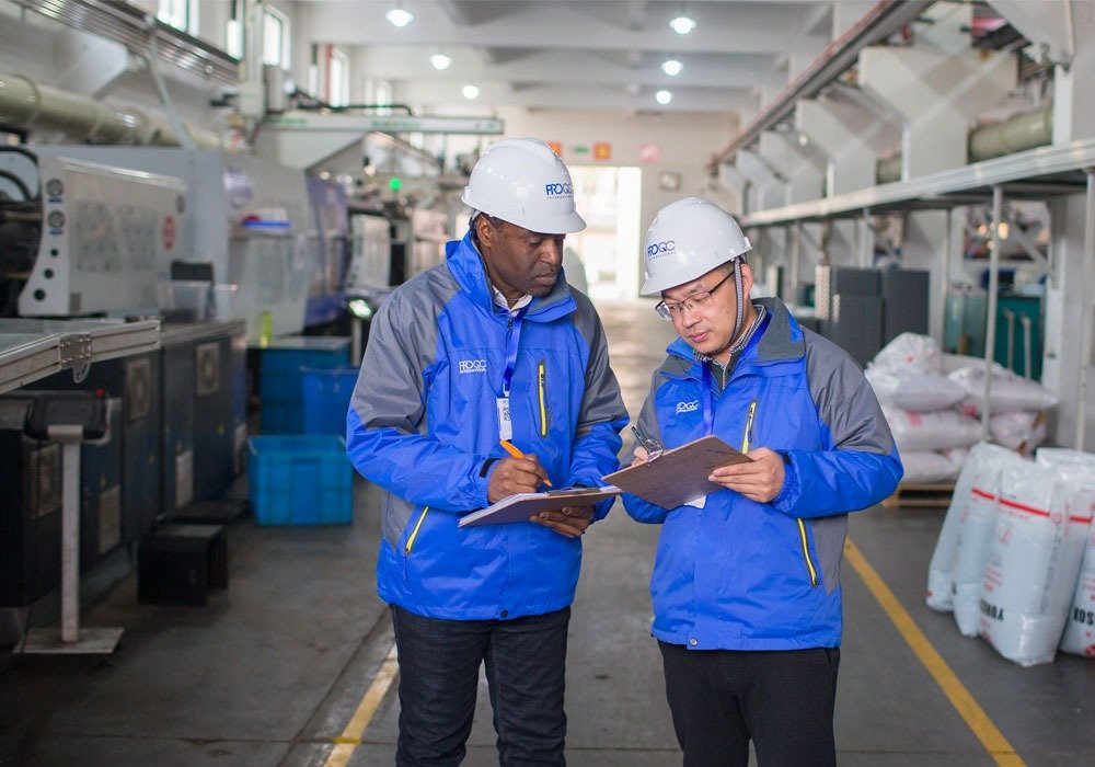 two persona are doing factory audit