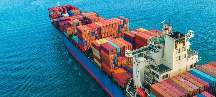A graphic image of a ship carrying many containers.
