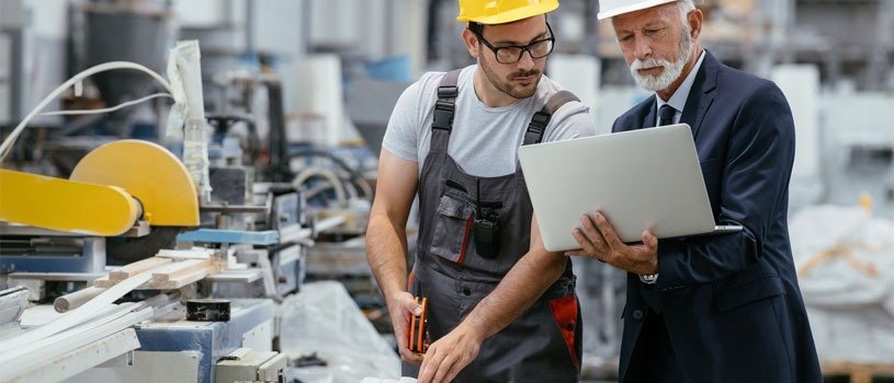 Two people reviewing their audit requirements.