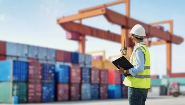 A person checks all containers after they have arrived.