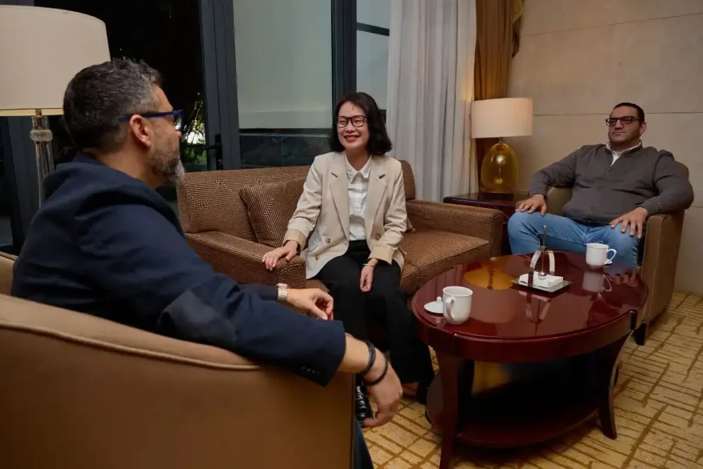 International buyer reviewing supplier quotations with a sourcing consultant 
