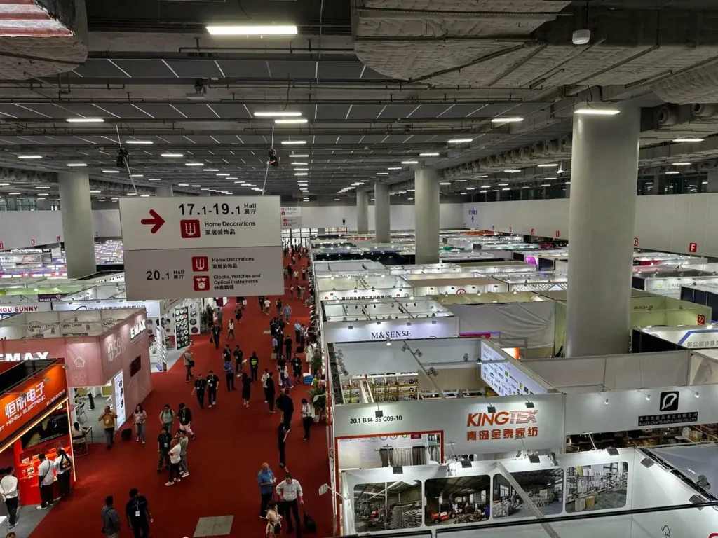 Business buyers reviewing supplier quotations and negotiation notes during the Canton Fair