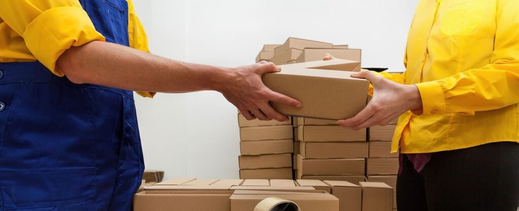 one person is handling a parcel to another